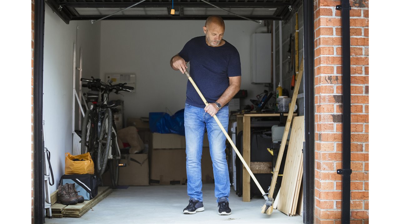 Man cleaning garage